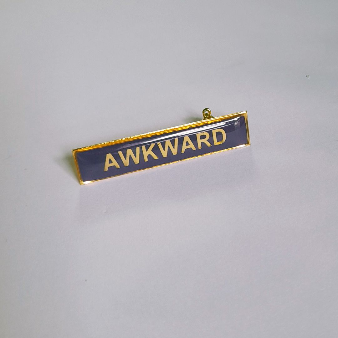 Tegan Iversen Awkward badge,  purple 3.8cm x .6cm