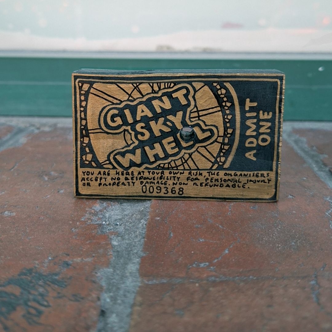 Tegan Iversen Giant sky wheel ticket artwork,  gold 8cm x 5cm x 2cm